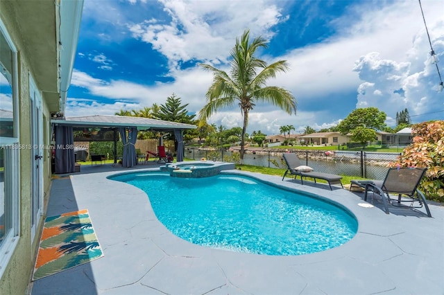 2239 NW 65th Ave, Margate, FL 33063 - view of pool featuring a pool with connected hot tub, a gazebo, a patio, and a water view