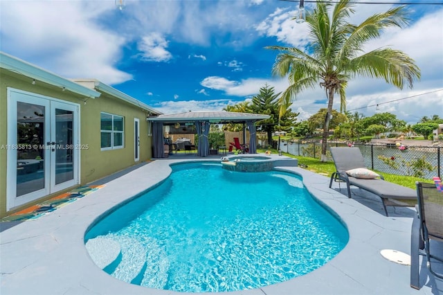 2239 NW 65th Ave, Margate, FL 33063 - view of pool with french doors, a pool with connected hot tub, a fenced backyard, a patio area, and a gazebo