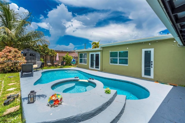 2239 NW 65th Ave, Margate, FL 33063 - view of swimming pool featuring french doors, a pool with connected hot tub, and a patio