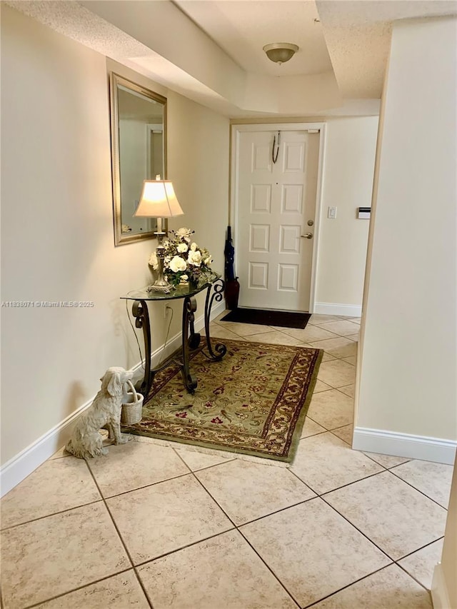 7751 Southampton Ter Unit 310, Tamarac, FL 33321 - entrance foyer featuring light tile patterned floors and a raised ceiling