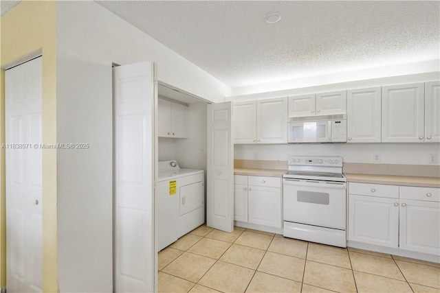 7751 Southampton Ter Unit 310, Tamarac, FL 33321 - kitchen featuring white appliances, washer / dryer, light countertops, white cabinetry, and a textured ceiling