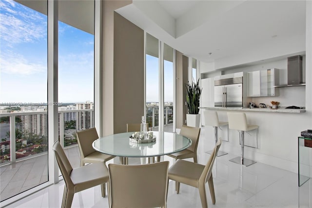 4100 Island Blvd Unit 2303, Aventura, FL 33160 - tiled dining space featuring floor to ceiling windows