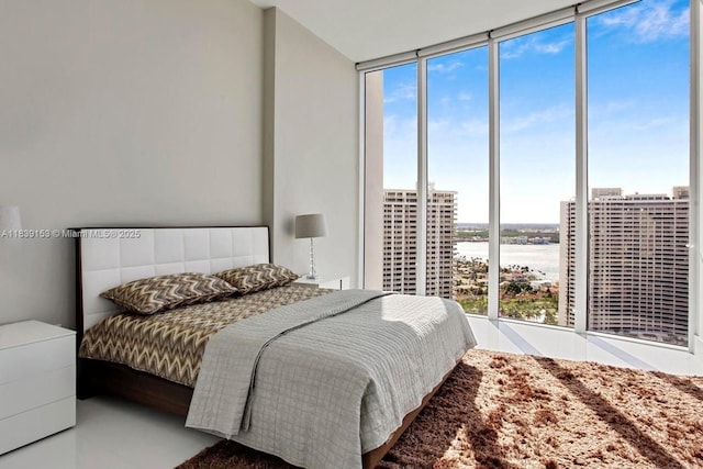 4100 Island Blvd Unit 2303, Aventura, FL 33160 - bedroom featuring expansive windows, a water view, and multiple windows