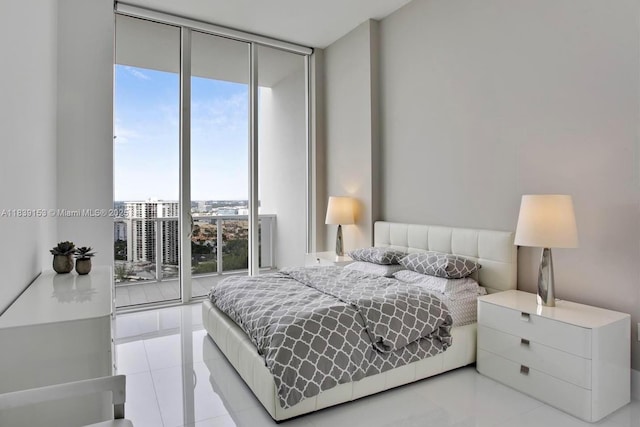 4100 Island Blvd Unit 2303, Aventura, FL 33160 - bedroom featuring a wall of windows, multiple windows, and light tile patterned floors