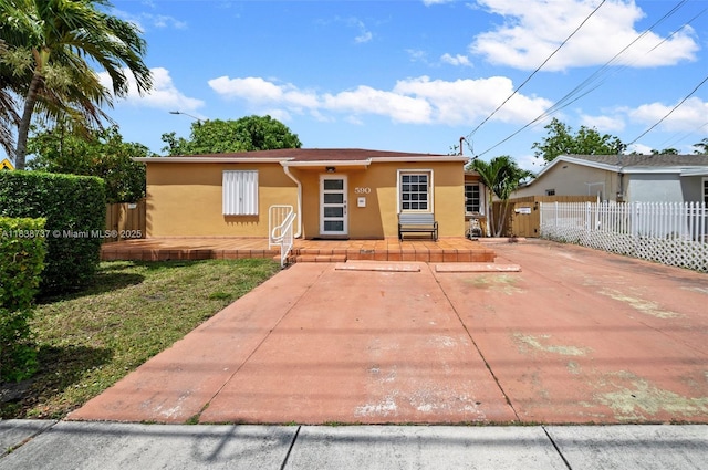 590 SW 62nd Ave, Miami, FL 33144 - view of front of house featuring stucco siding and a porch