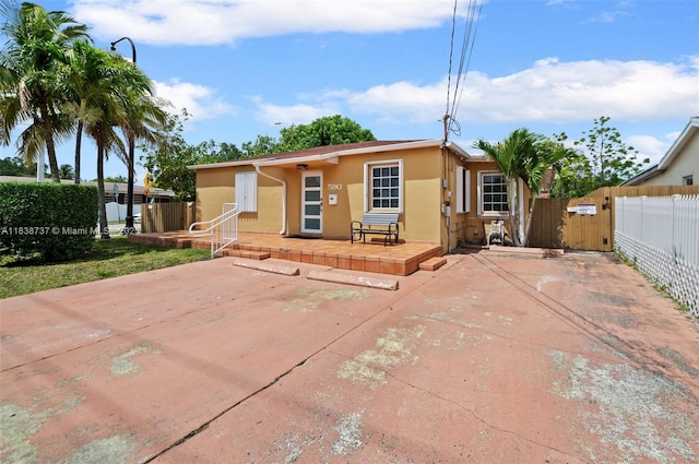 590 SW 62nd Ave, Miami, FL 33144 - view of front of home with stucco siding and a gate