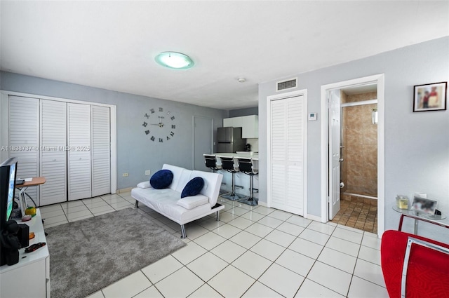 590 SW 62nd Ave, Miami, FL 33144 - living room with light tile patterned floors and baseboards