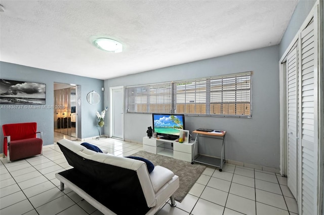 590 SW 62nd Ave, Miami, FL 33144 - living room with light tile patterned floors and a textured ceiling