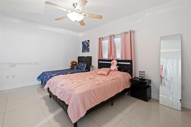 590 SW 62nd Ave, Miami, FL 33144 - bedroom with light tile patterned floors and a ceiling fan