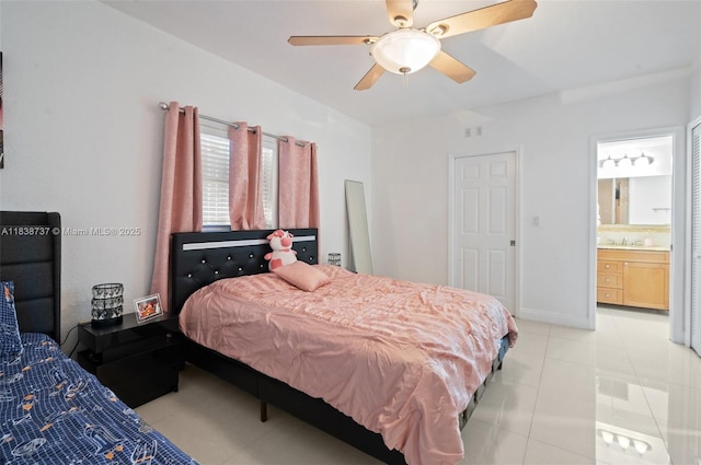 590 SW 62nd Ave, Miami, FL 33144 - bedroom featuring light tile patterned flooring, ensuite bath, and a ceiling fan