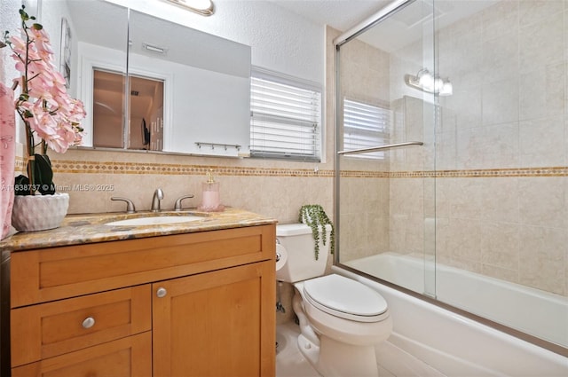 590 SW 62nd Ave, Miami, FL 33144 - bathroom featuring vanity, combined bath / shower with glass door, and backsplash