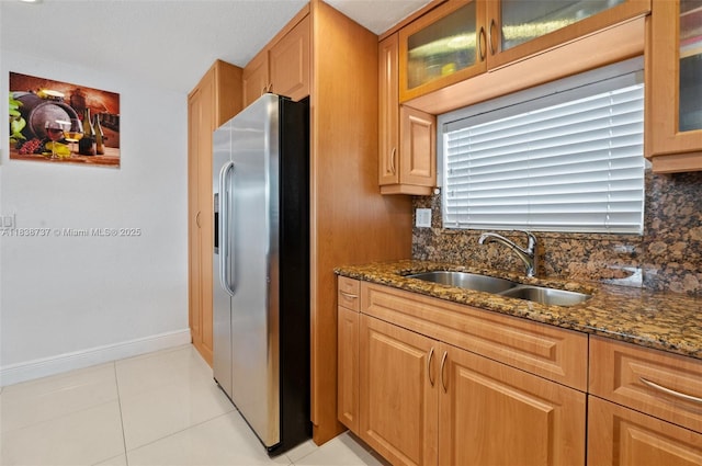 590 SW 62nd Ave, Miami, FL 33144 - kitchen with stainless steel fridge with ice dispenser, dark stone countertops, and backsplash