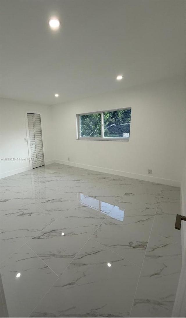 1655 NW 111th Way, Coral Springs, FL 33071 - spare room with light marble finish floors and recessed lighting