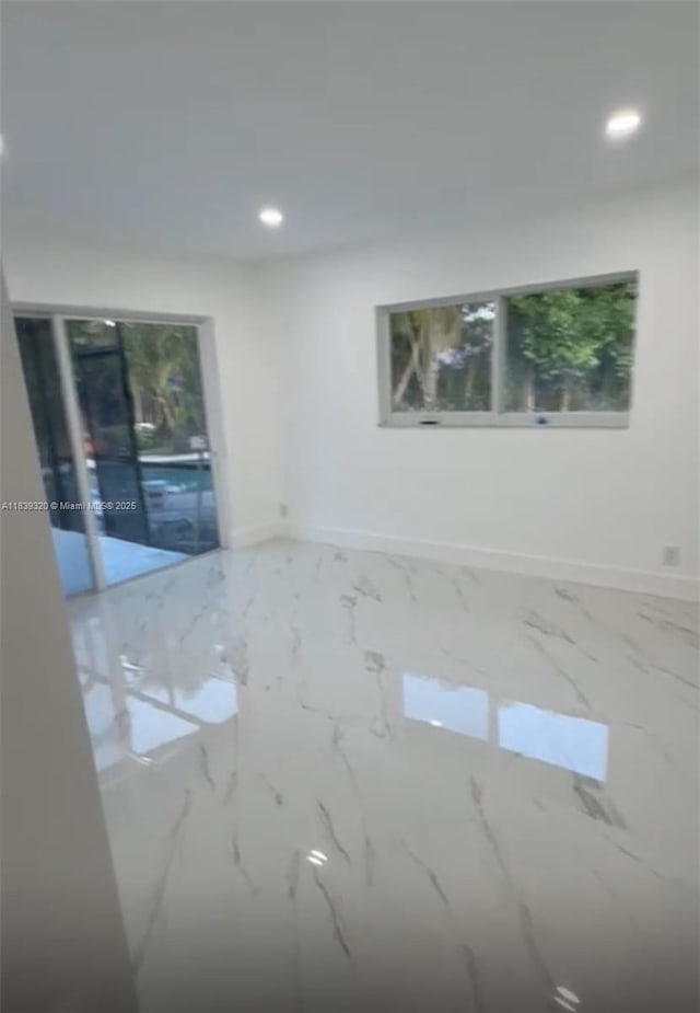 1655 NW 111th Way, Coral Springs, FL 33071 - unfurnished room with recessed lighting and marble finish floors