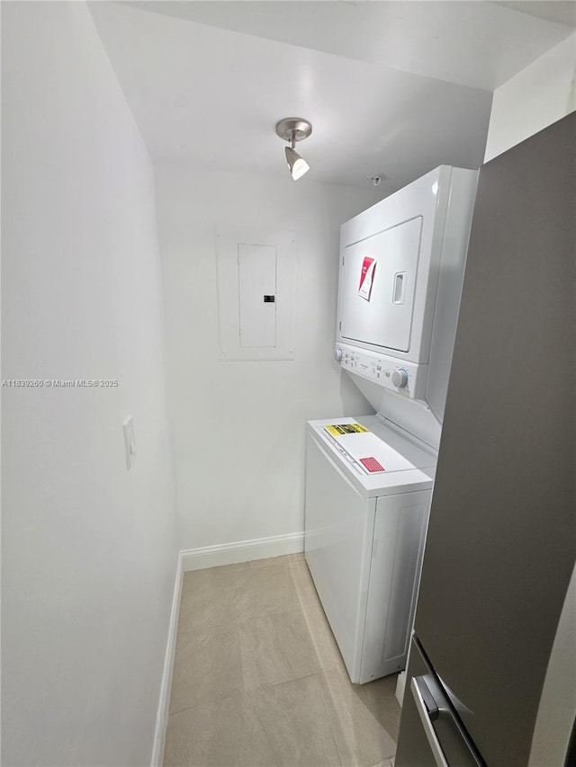 2620 S University Dr Unit 111, Davie, FL 33328 - laundry room featuring electric panel and stacked washer and clothes dryer