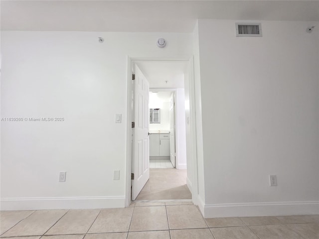 2620 S University Dr Unit 111, Davie, FL 33328 - corridor with light tile patterned floors and baseboards