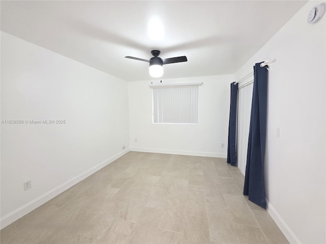 2620 S University Dr Unit 111, Davie, FL 33328 - spare room featuring a ceiling fan and a smoke detector