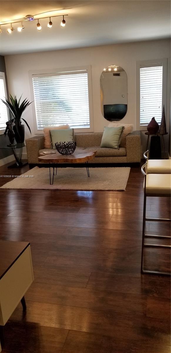1337 Euclid Ave Unit 101, Miami Beach, FL 33139 - living room with healthy amount of natural light and dark wood-type flooring