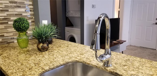 1337 Euclid Ave Unit 101, Miami Beach, FL 33139 - detailed view of estacked washer and dryer and light stone countertops