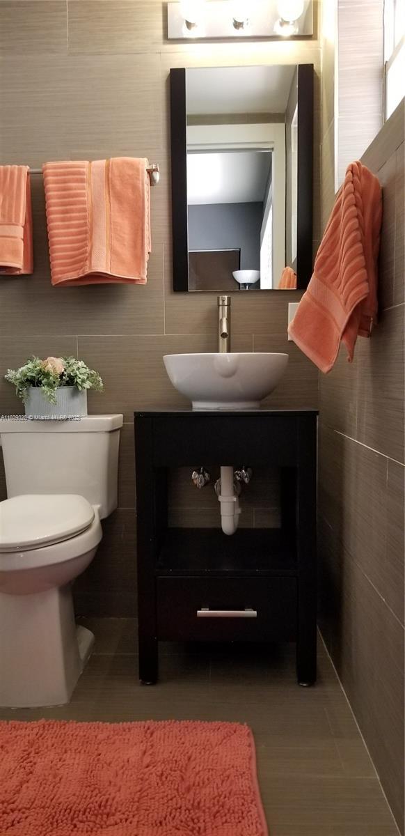 1337 Euclid Ave Unit 101, Miami Beach, FL 33139 - half bathroom featuring toilet and vanity