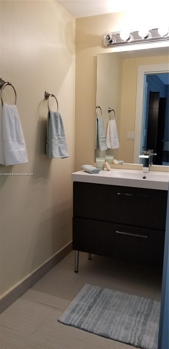 1337 Euclid Ave Unit 101, Miami Beach, FL 33139 - bathroom with vanity and baseboards