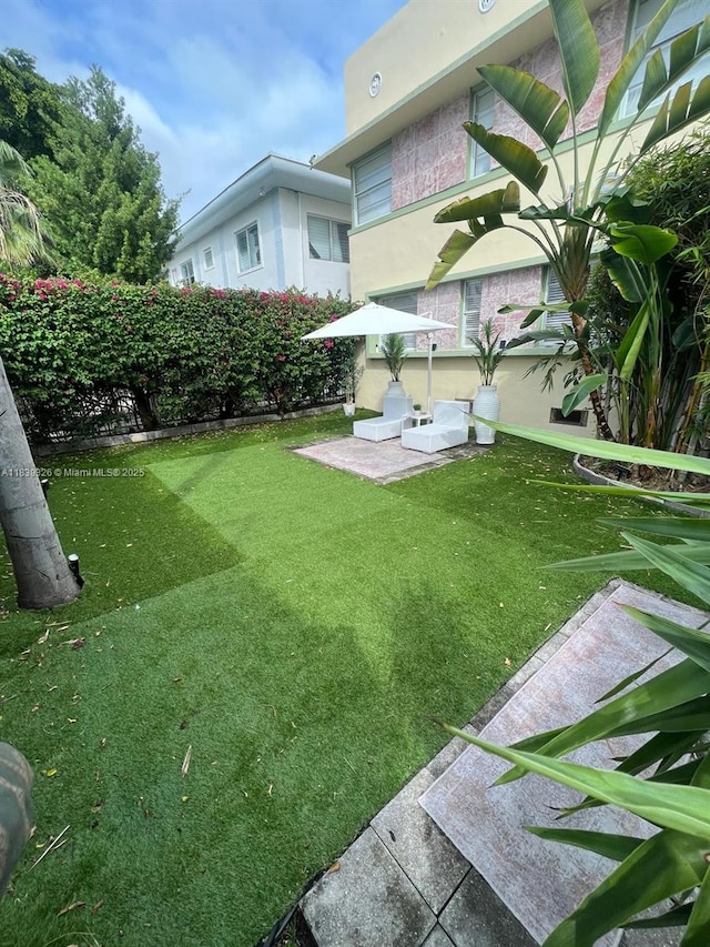 1337 Euclid Ave Unit 101, Miami Beach, FL 33139 - view of green lawn featuring a patio area