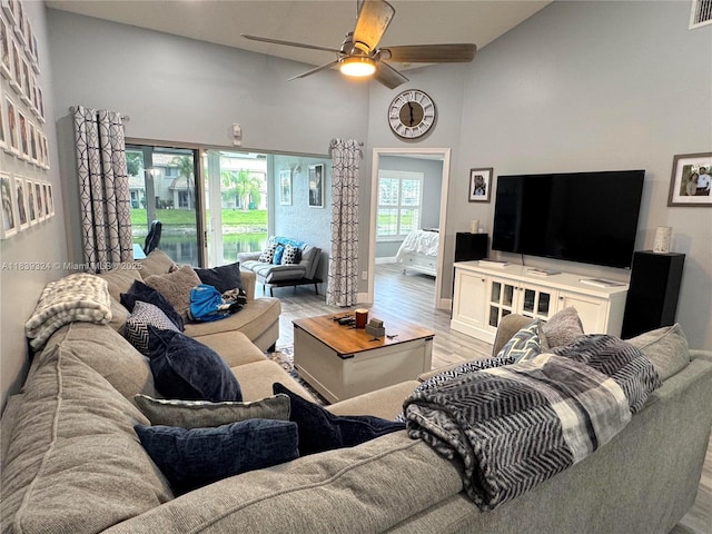 5928 NW 93rd Ter, Tamarac, FL 33321 - living area with light wood-style flooring, ceiling fan, and high vaulted ceiling