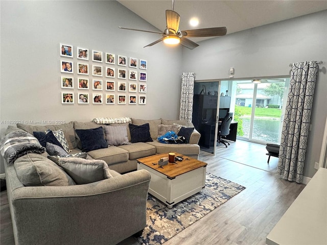 5928 NW 93rd Ter, Tamarac, FL 33321 - living room featuring wood finished floors, ceiling fan, high vaulted ceiling, and a desk