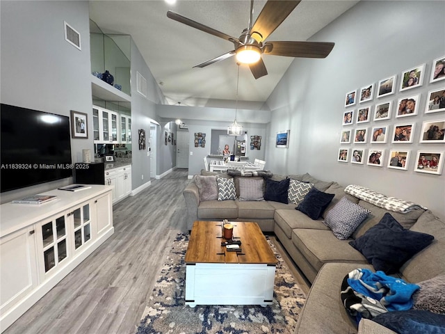 5928 NW 93rd Ter, Tamarac, FL 33321 - living area featuring high vaulted ceiling, light wood finished floors, and a ceiling fan