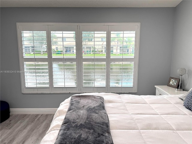 5928 NW 93rd Ter, Tamarac, FL 33321 - bedroom featuring multiple windows and wood finished floors