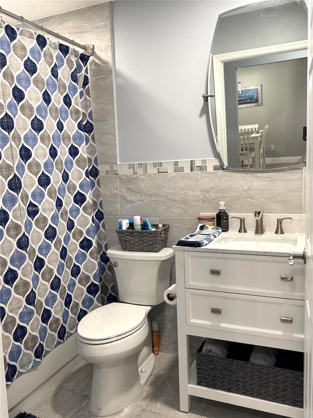 5928 NW 93rd Ter, Tamarac, FL 33321 - bathroom with tile walls, vanity, a shower with curtain, and wainscoting