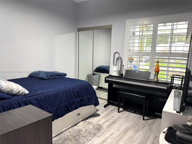 5928 NW 93rd Ter, Tamarac, FL 33321 - bedroom with wood finished floors, a closet, and multiple windows