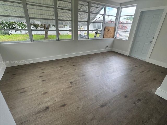8521 NW 57th Ct, Tamarac, FL 33321 - unfurnished sunroom featuring wood finished floors and baseboards