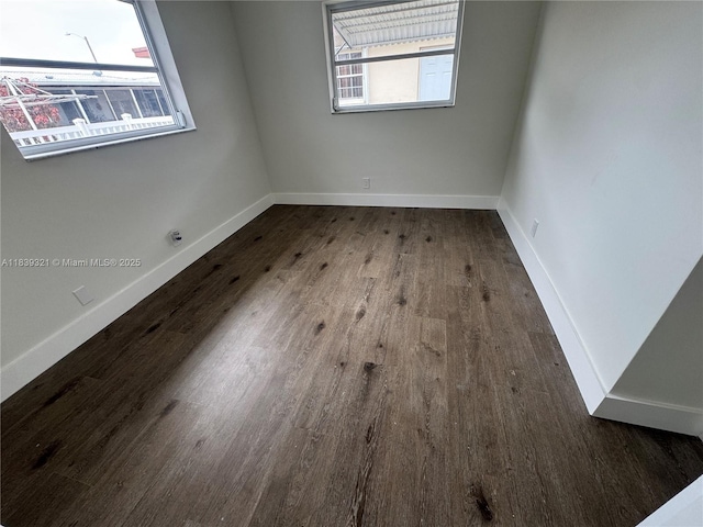 8521 NW 57th Ct, Tamarac, FL 33321 - unfurnished room with wood finished floors and baseboards