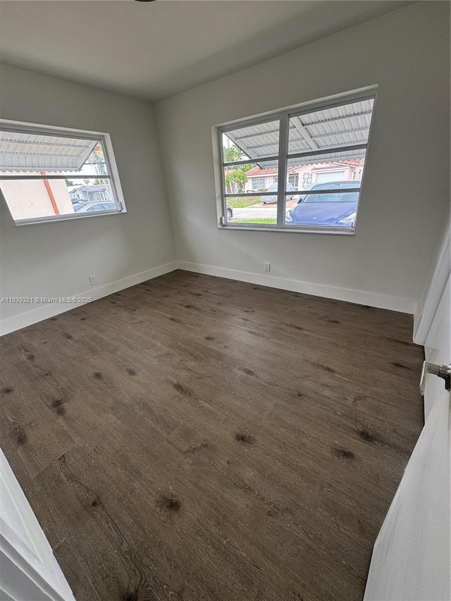 8521 NW 57th Ct, Tamarac, FL 33321 - unfurnished room with dark wood-type flooring