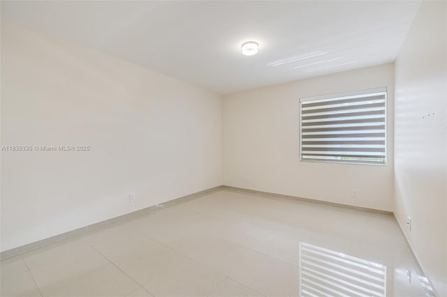 471 Capri J Unit 471, Delray Beach, FL 33484 - spare room featuring light tile patterned flooring and baseboards