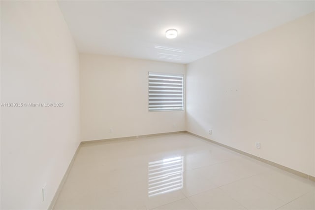471 Capri J Unit 471, Delray Beach, FL 33484 - spare room featuring tile patterned flooring and baseboards