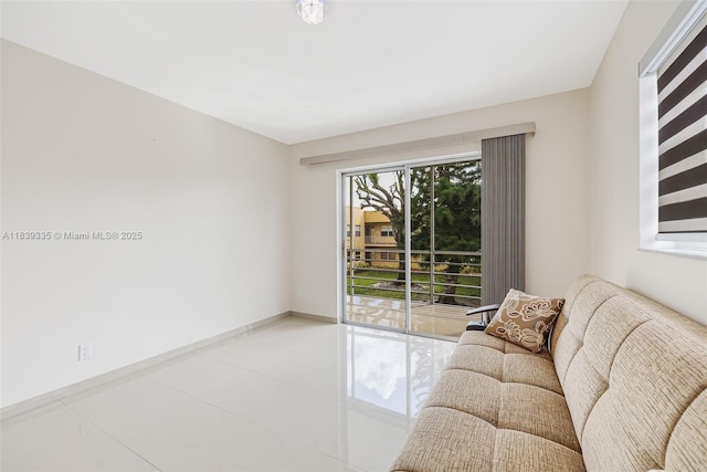 471 Capri J Unit 471, Delray Beach, FL 33484 - living room with baseboards and light tile patterned floors