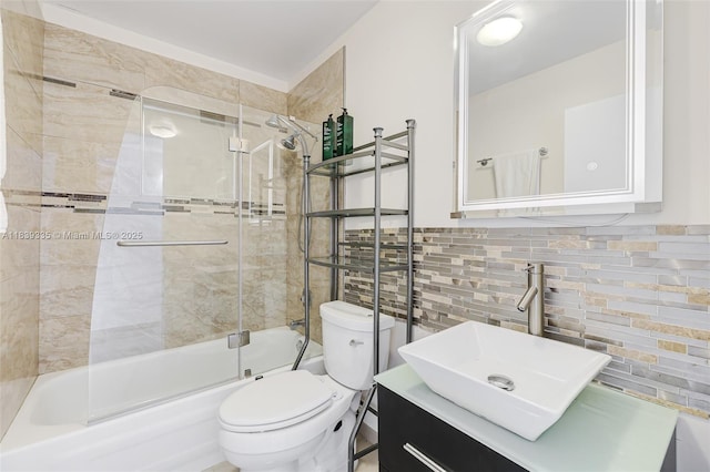 471 Capri J Unit 471, Delray Beach, FL 33484 - full bathroom with bath / shower combo with glass door, vanity, decorative backsplash, and tile walls