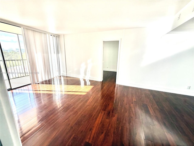 20335 W Country Club Dr Unit 502, Aventura, FL 33180 - empty room featuring wood finished floors and a wall of windows