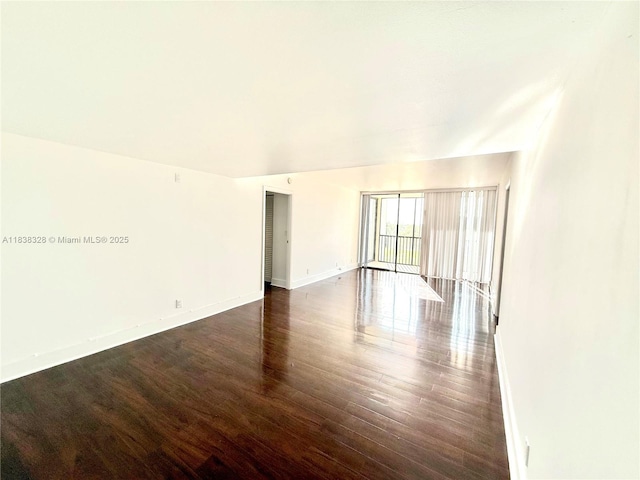 20335 W Country Club Dr Unit 502, Aventura, FL 33180 - unfurnished room featuring dark wood-type flooring and baseboards