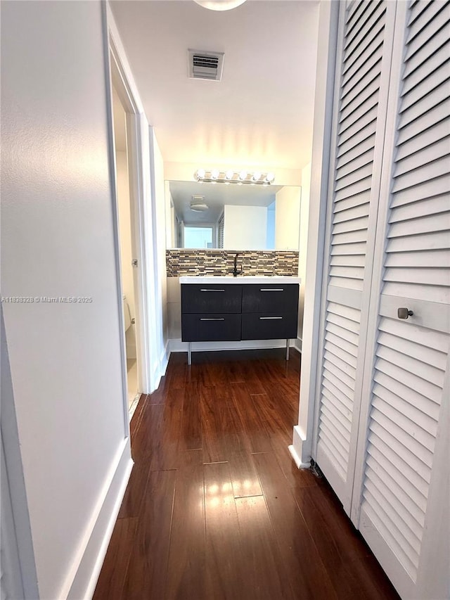 20335 W Country Club Dr Unit 502, Aventura, FL 33180 - hall with dark wood-style floors and baseboards