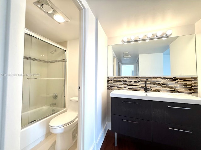 20335 W Country Club Dr Unit 502, Aventura, FL 33180 - bathroom with vanity, bath / shower combo with glass door, and decorative backsplash
