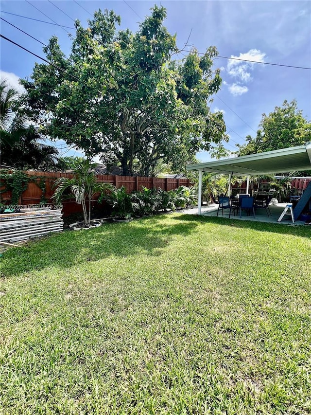 6120 SW 15th Ct, North Lauderdale, FL 33068 - fenced yard featuring a patio