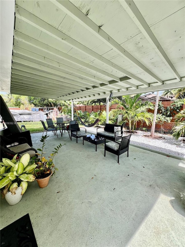 6120 SW 15th Ct, North Lauderdale, FL 33068 - fenced backyard with a patio area, an outdoor hangout area, and outdoor dining area