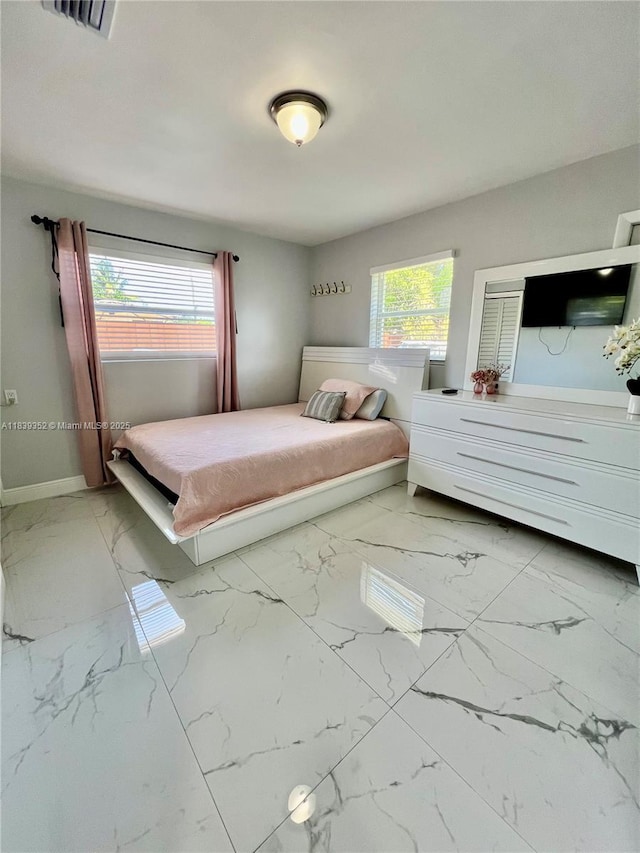 6120 SW 15th Ct, North Lauderdale, FL 33068 - bedroom with multiple windows and marble look tile flooring