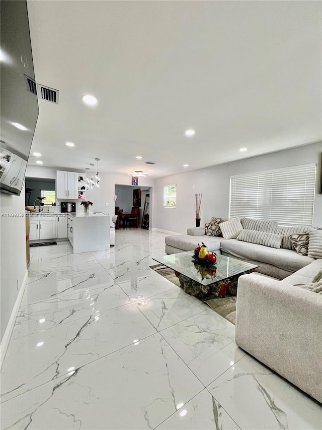 6120 SW 15th Ct, North Lauderdale, FL 33068 - living room with recessed lighting and light marble finish flooring