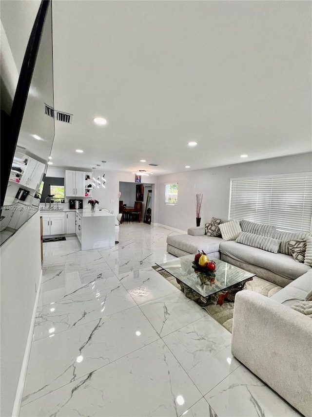 6120 SW 15th Ct, North Lauderdale, FL 33068 - living room with light marble finish flooring and recessed lighting