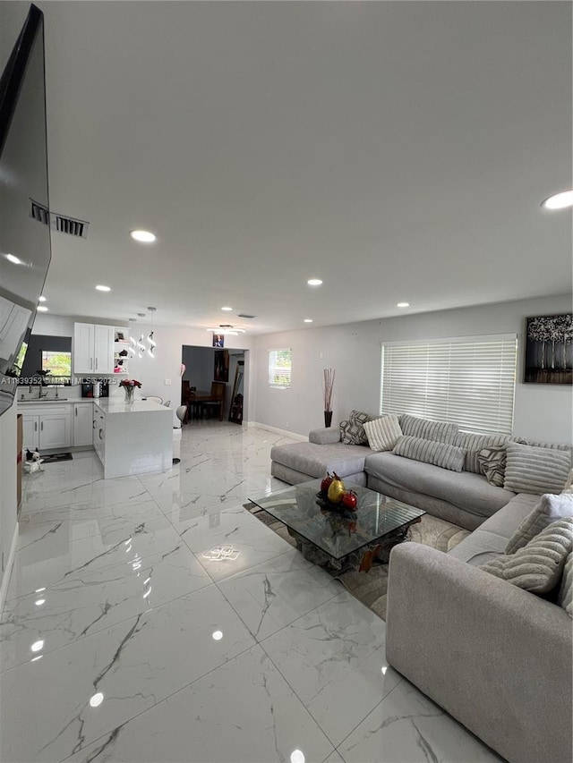 6120 SW 15th Ct, North Lauderdale, FL 33068 - living room featuring recessed lighting and light marble finish flooring