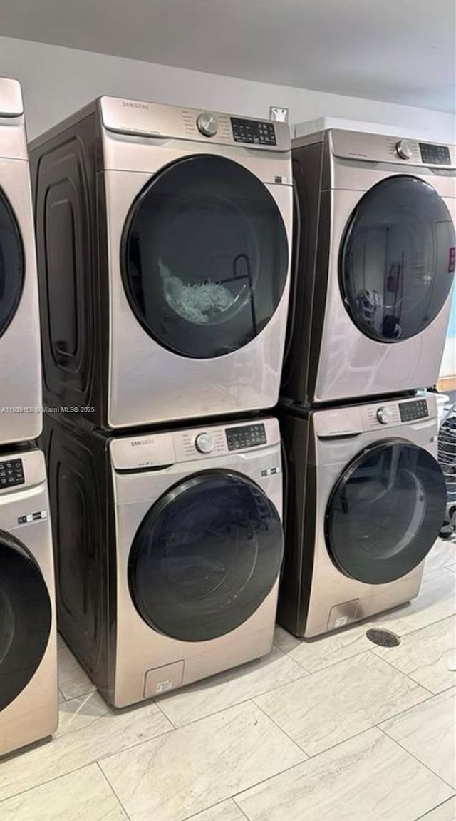 720 Collins Ave Unit 310, Miami Beach, FL 33139 - laundry room with stacked washer and clothes dryer and washing machine and clothes dryer